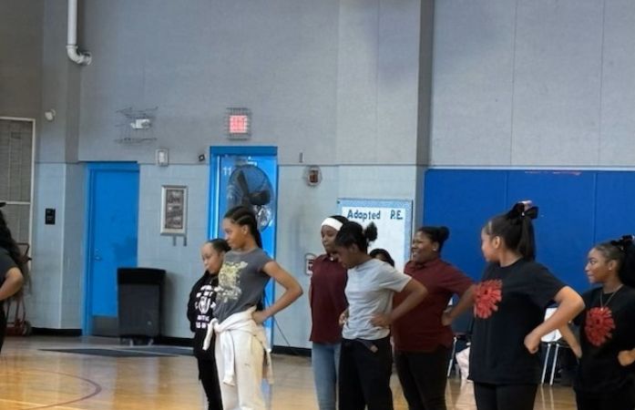  Girls standing in formation for a cheer